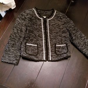 A cropped black and silver blazer